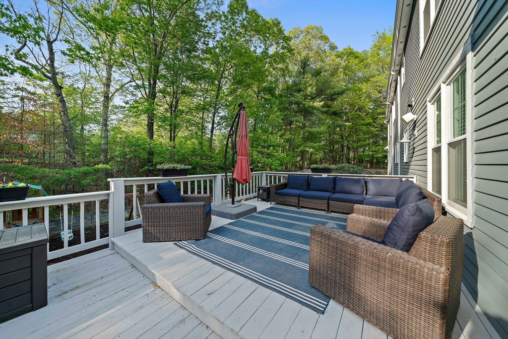 100 York Brook Road Canton, MA 02021 - Photo 41 of 42 a balcony with wooden floor and outdoor seating