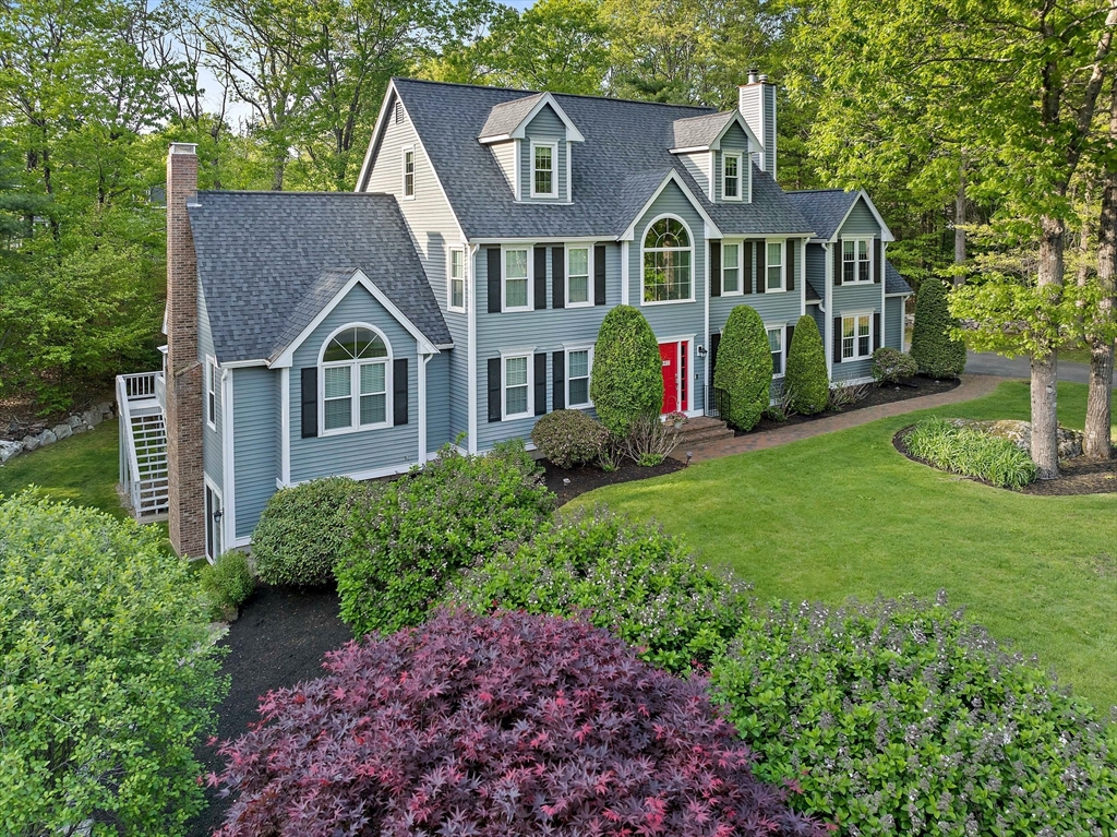 100 York Brook Road Canton, MA 02021 - Photo 5 of 42 a front view of a house with a garden