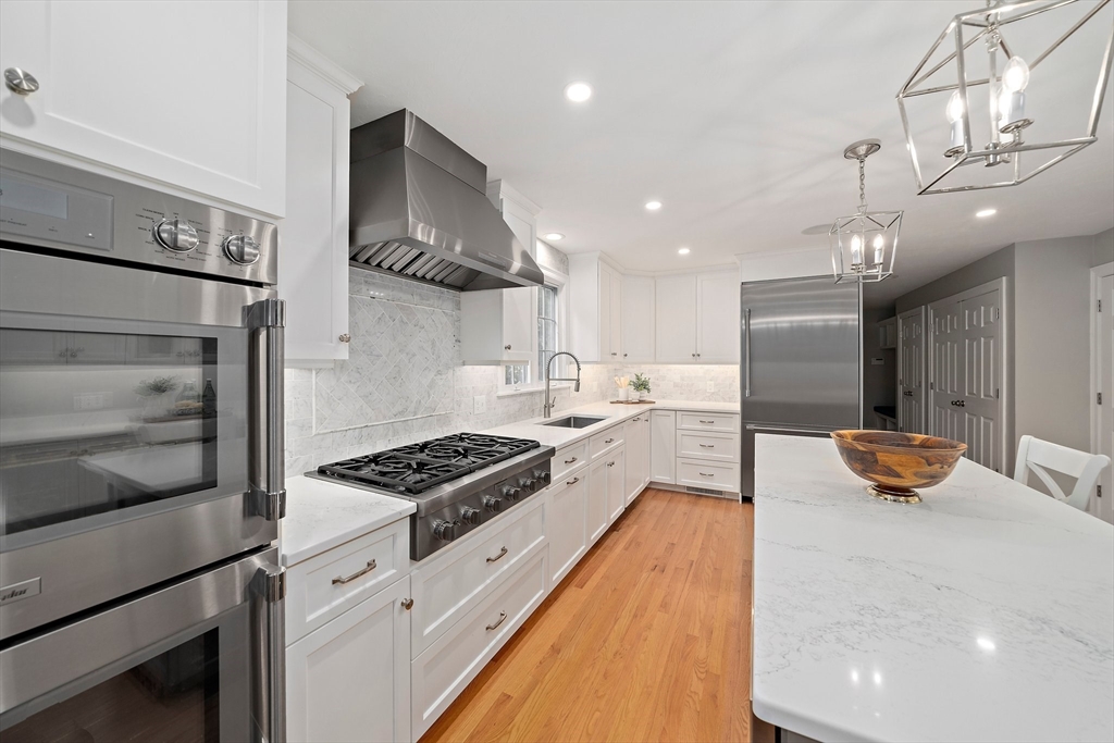 100 York Brook Road Canton, MA 02021 - Photo 8 of 42 a kitchen with stainless steel appliances a sink a stove a refrigerator and cabinets