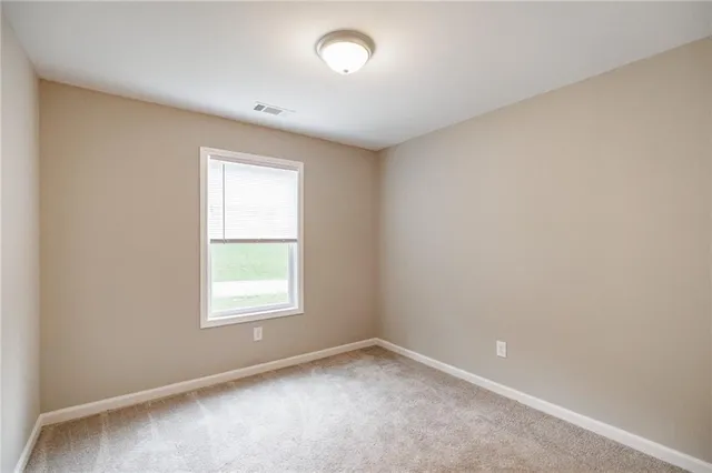 an empty room with closet area