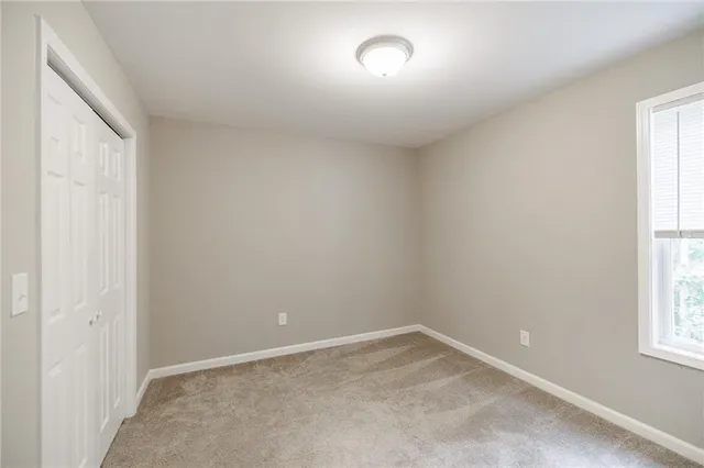 a bathroom with a bathtub shower sink vanity and toilet