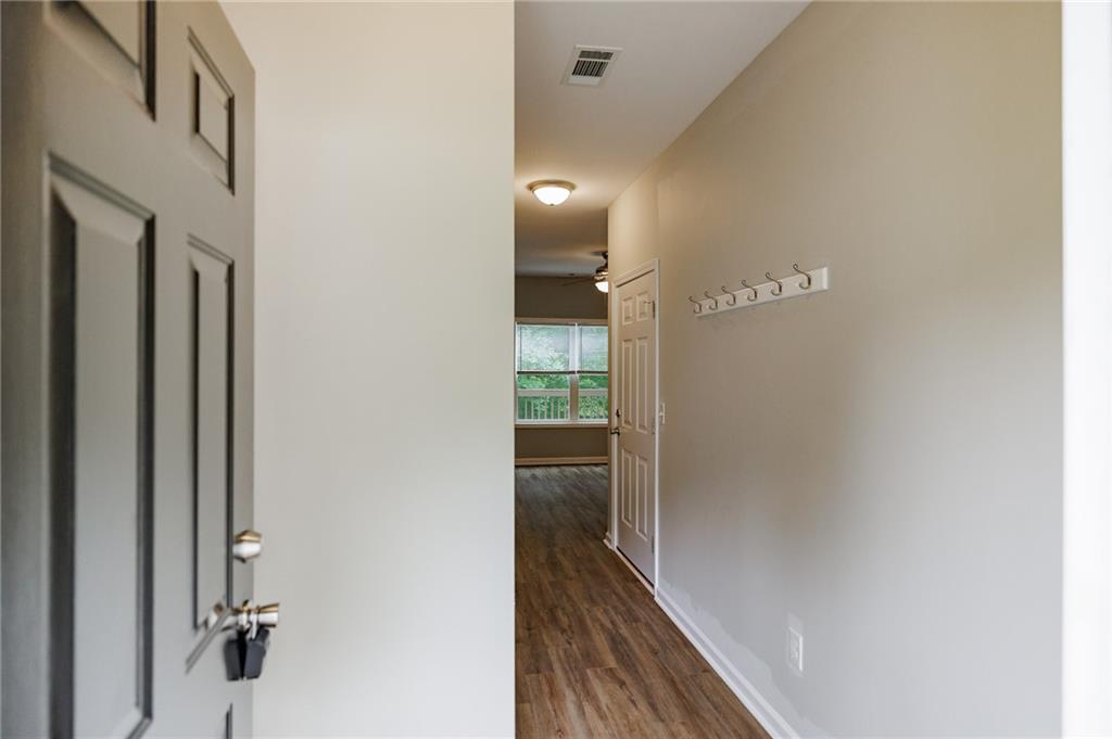 103 Three Rivers Court Hull, GA 30646 - Photo 6 of 40 a view of a hallway with wooden floor
