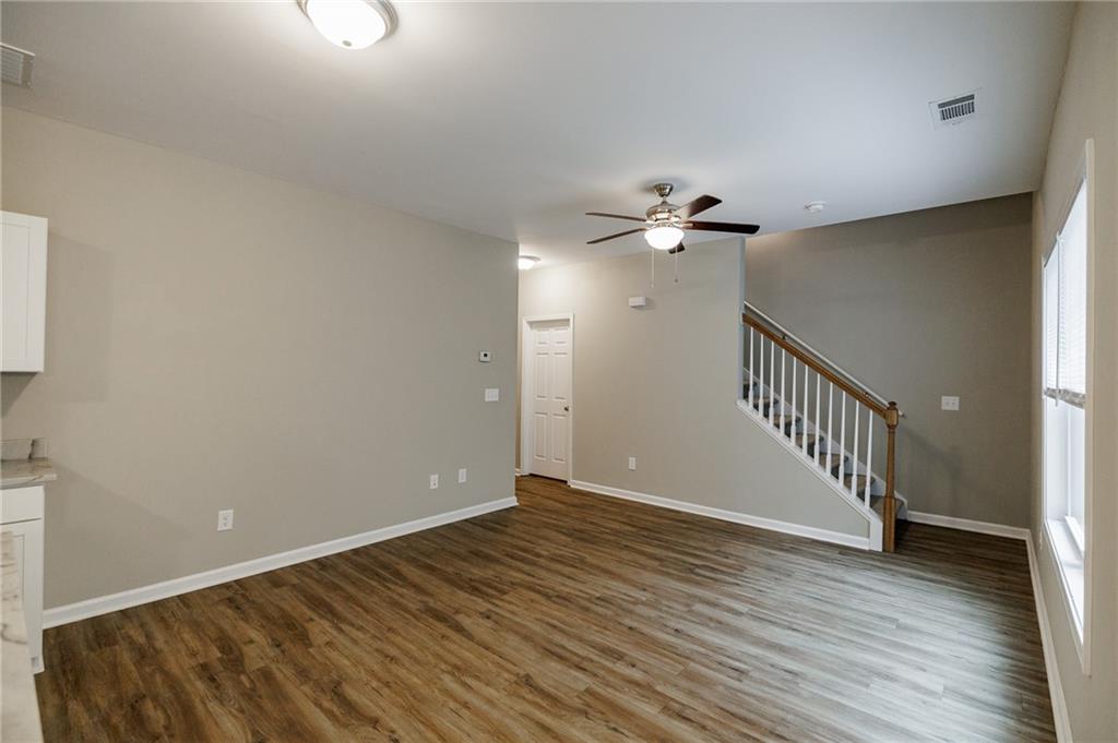 103 Three Rivers Court Hull, GA 30646 - Photo 10 of 40 wooden floor in an empty room with a window