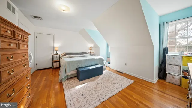 a bed room with a bed and a window