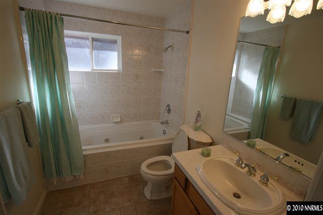 1701 Berkeley Drive Reno, NV 89509 - Photo 7 of 9 a bathroom with a sink toilet and shower