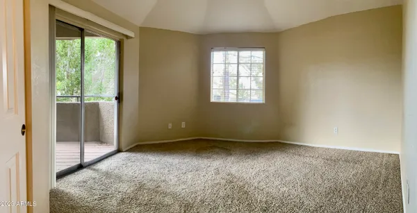 a view of an empty room and window