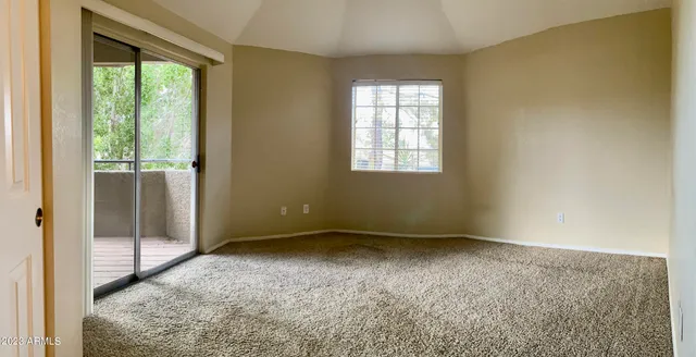 a view of an empty room and window
