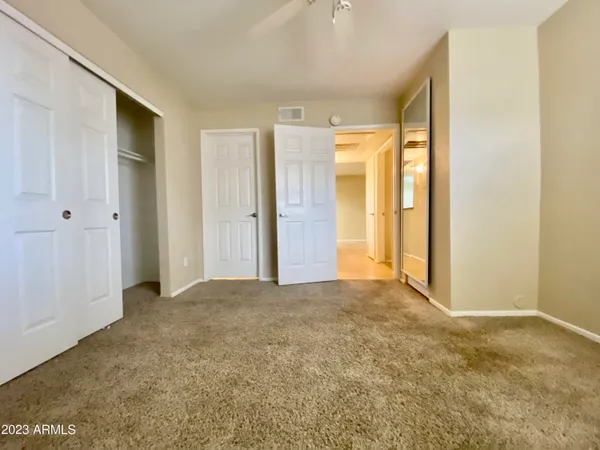 a bathroom with a double vanity sink toilet and shower