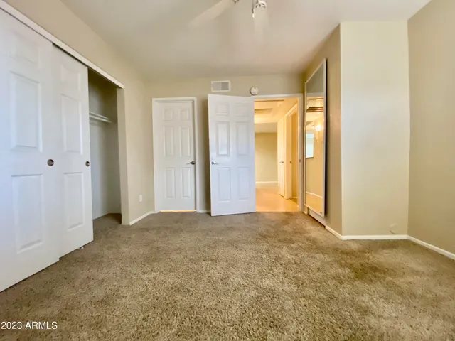 a bathroom with a double vanity sink toilet and shower