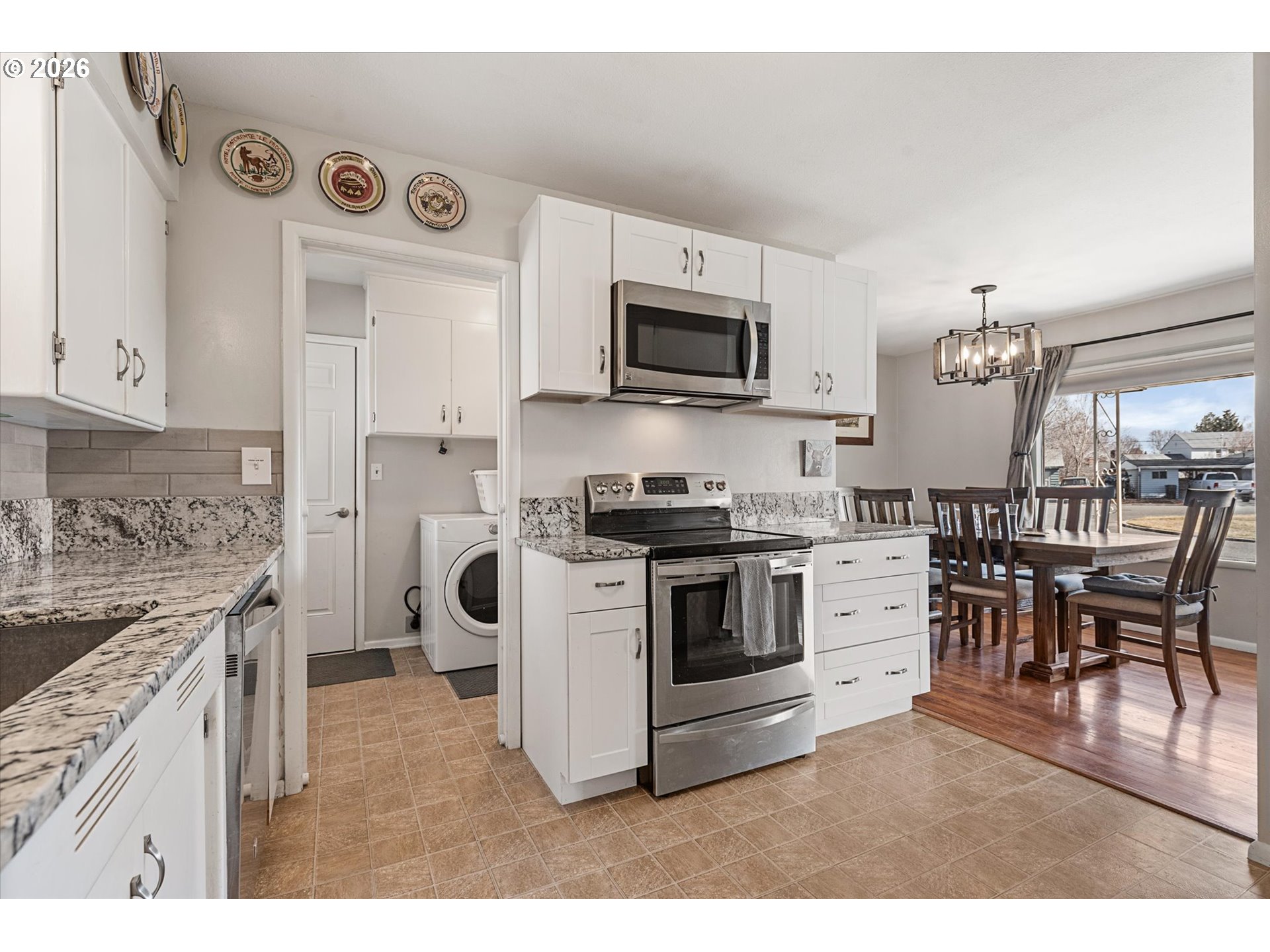 2975 North 3rd Street Baker City, OR 97814 - Photo 14 of 48 a kitchen with stainless steel appliances granite countertop a stove top oven a sink a counter top space and cabinets