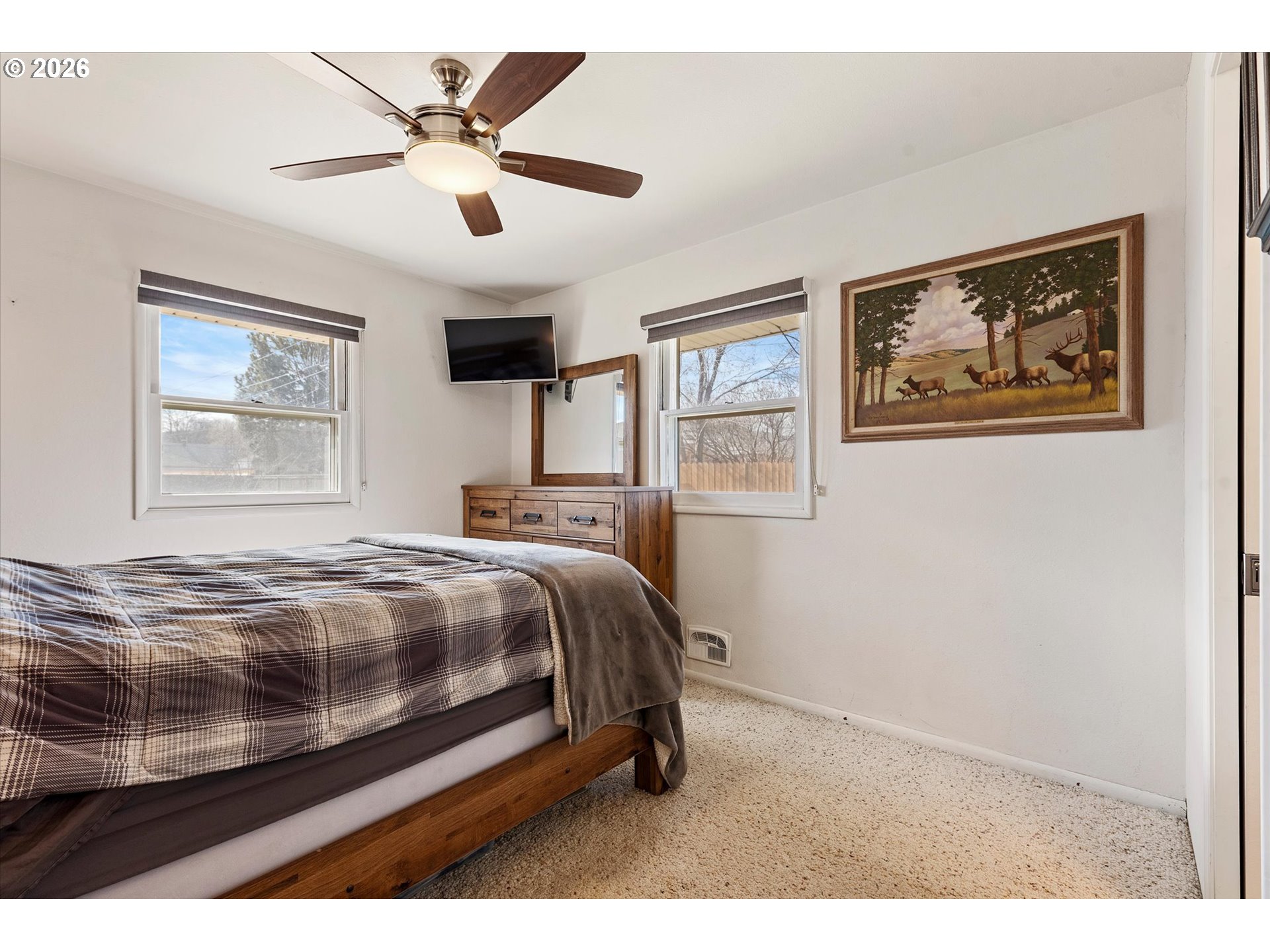 2975 North 3rd Street Baker City, OR 97814 - Photo 21 of 48 a bedroom with a bed and a painting on the wall