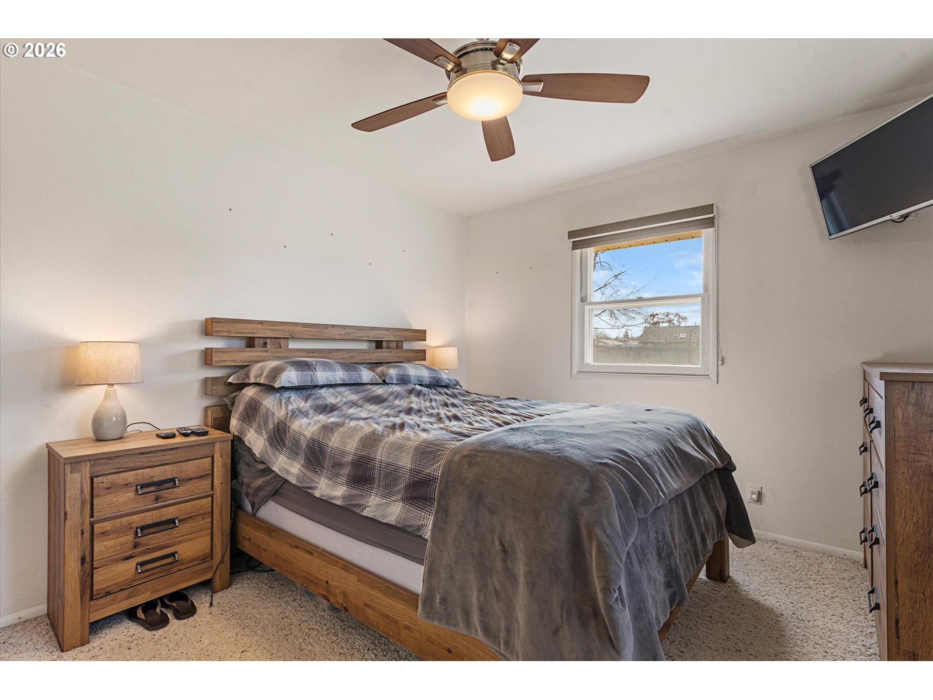 2975 North 3rd Street Baker City, OR 97814 - Photo 22 of 48 a bedroom with a bed and a chandelier
