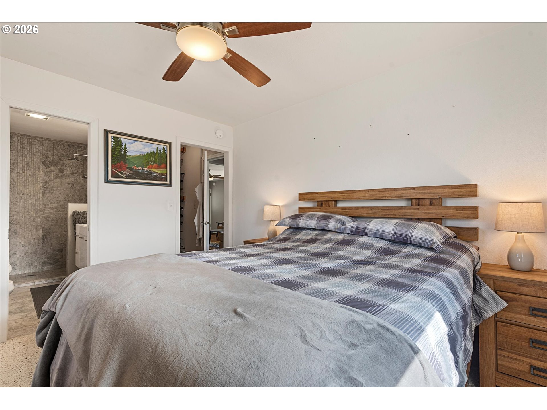 2975 North 3rd Street Baker City, OR 97814 - Photo 23 of 48 a bedroom with a bed and a chandelier
