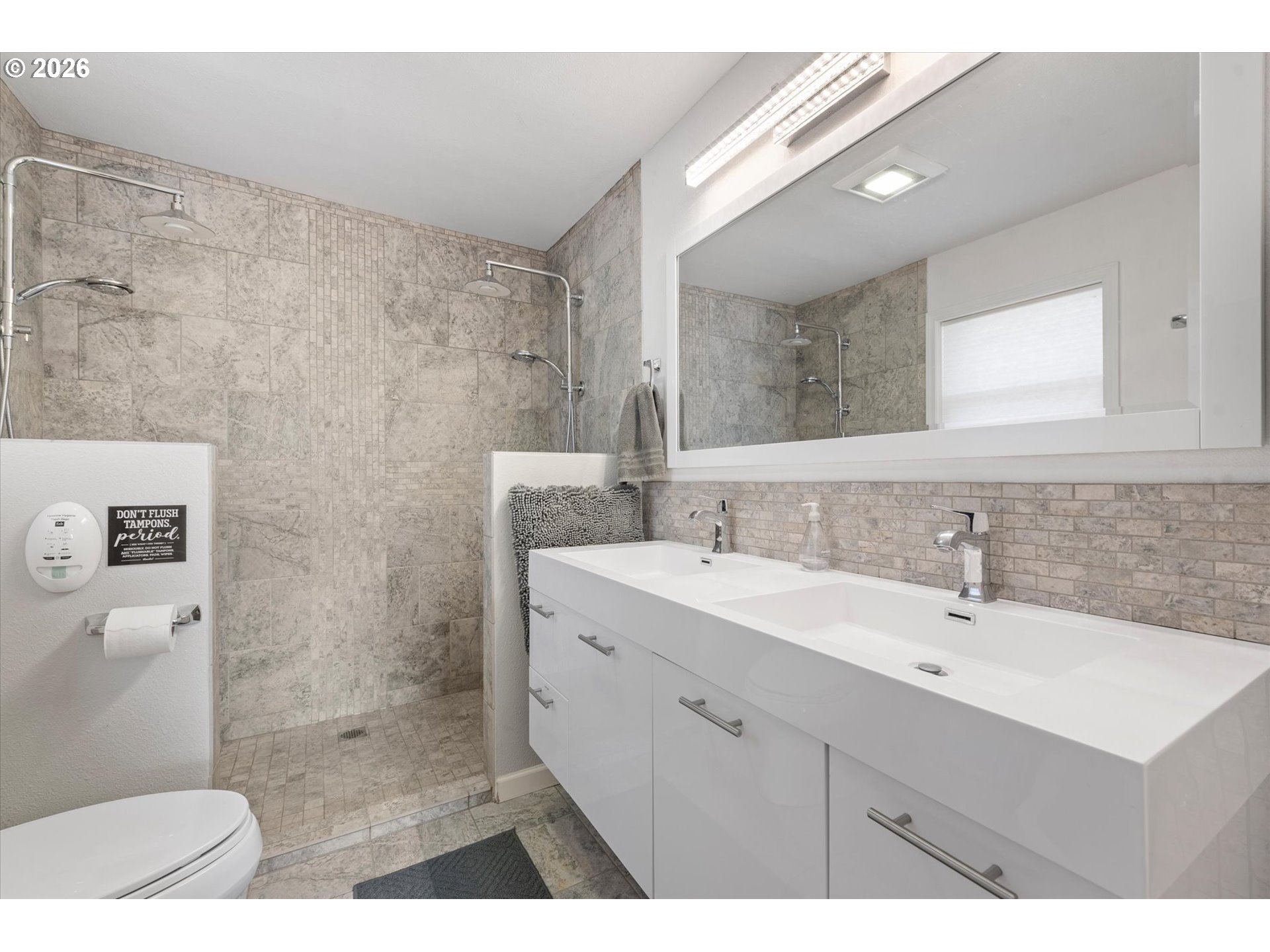 2975 North 3rd Street Baker City, OR 97814 - Photo 25 of 48 a bathroom with a sink a toilet and a mirror