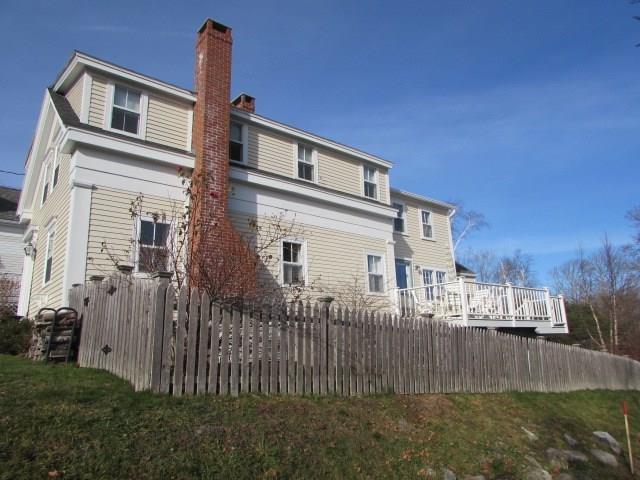 7 Green Street Castine, ME 04421 - Photo 2 of 16 View of side yard and deck...