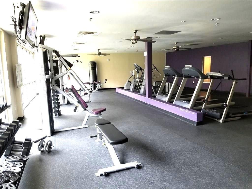 1100 West Trinity Mills Road, Unit 3039 Carrollton, TX 75006 - Photo 15 of 25 a view of a room with gym equipment
