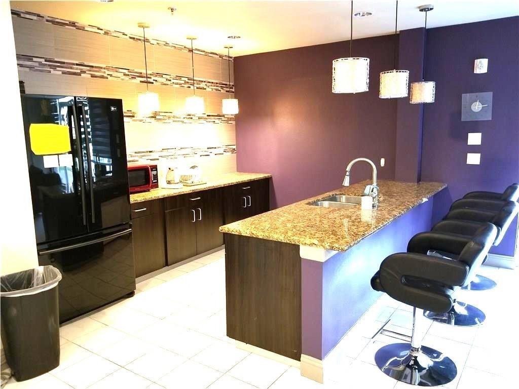 1100 West Trinity Mills Road, Unit 3039 Carrollton, TX 75006 - Photo 20 of 25 a kitchen with a table and chairs