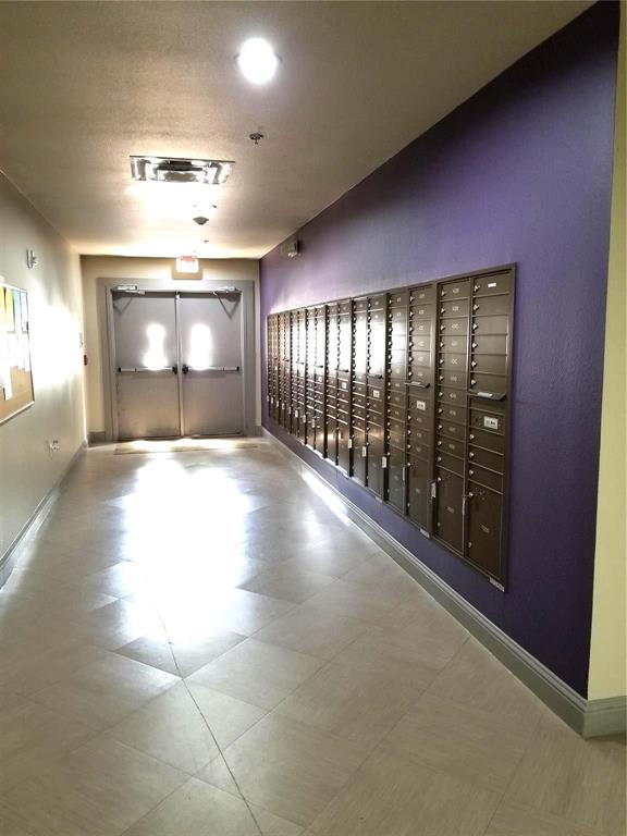 1100 West Trinity Mills Road, Unit 3039 Carrollton, TX 75006 - Photo 22 of 25 a view of an empty room with a windows and fireplace