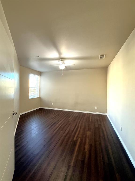 1100 West Trinity Mills Road, Unit 3039 Carrollton, TX 75006 - Photo 4 of 25 wooden floor in an empty room