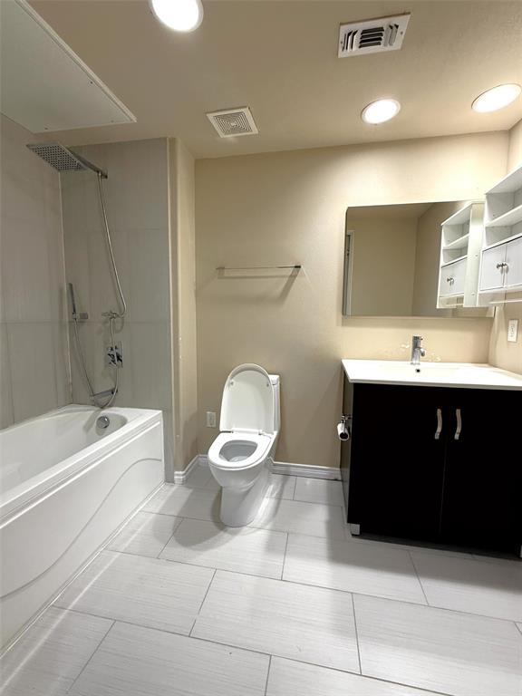 1100 West Trinity Mills Road, Unit 3039 Carrollton, TX 75006 - Photo 6 of 25 a bathroom with a sink toilet and shower