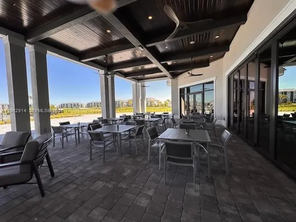 a outdoor space with lots of tables and chairs