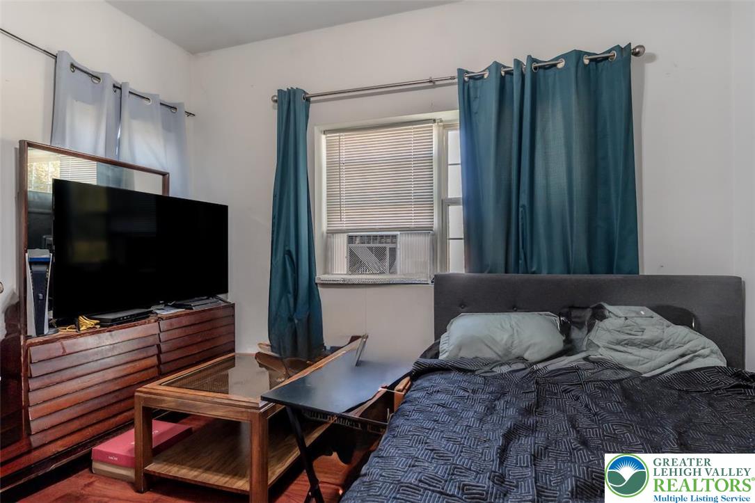 1220 Hay Road Temple, PA 19560 - Photo 11 of 27 a bedroom with a bed and flat screen tv