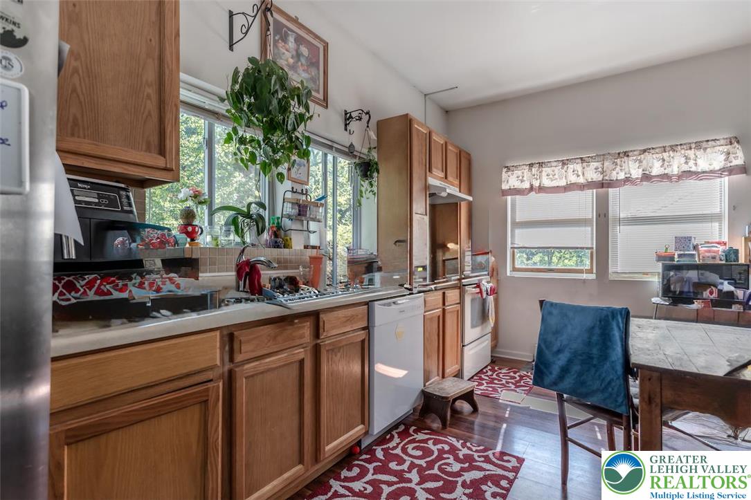 1220 Hay Road Temple, PA 19560 - Photo 12 of 27 a kitchen with a sink stove and cabinets