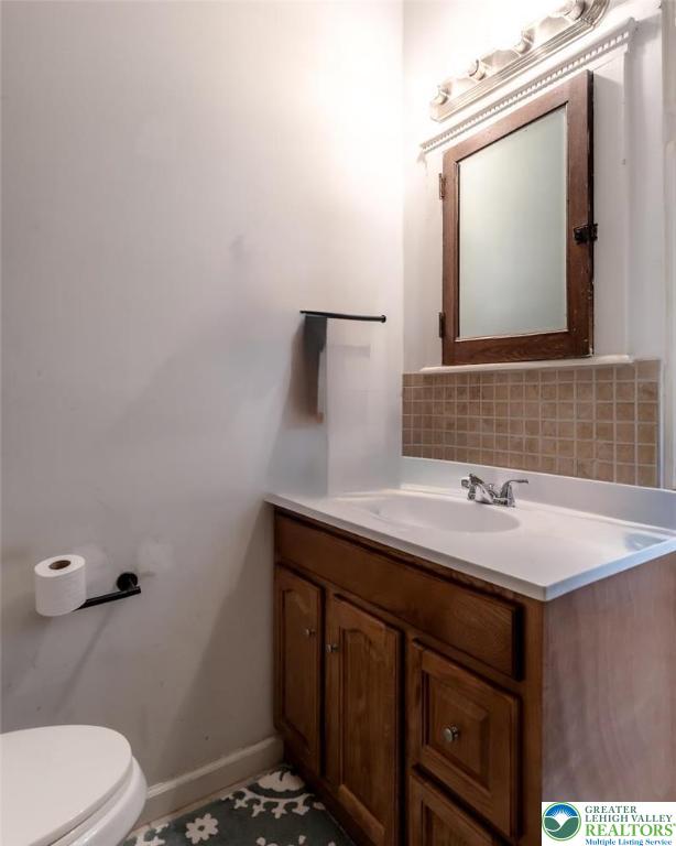 1220 Hay Road Temple, PA 19560 - Photo 13 of 27 a bathroom with a sink toilet and mirror