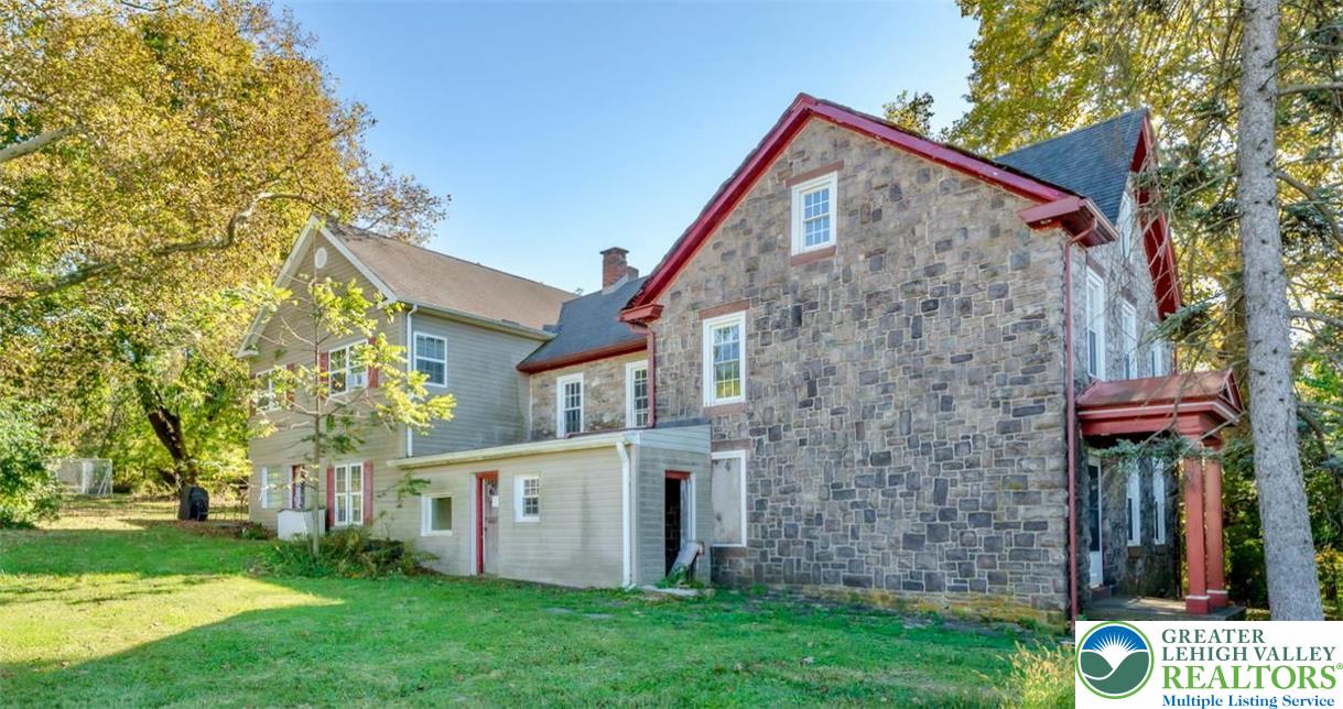 1220 Hay Road Temple, PA 19560 - Photo 3 of 27 front view of a house with a yard