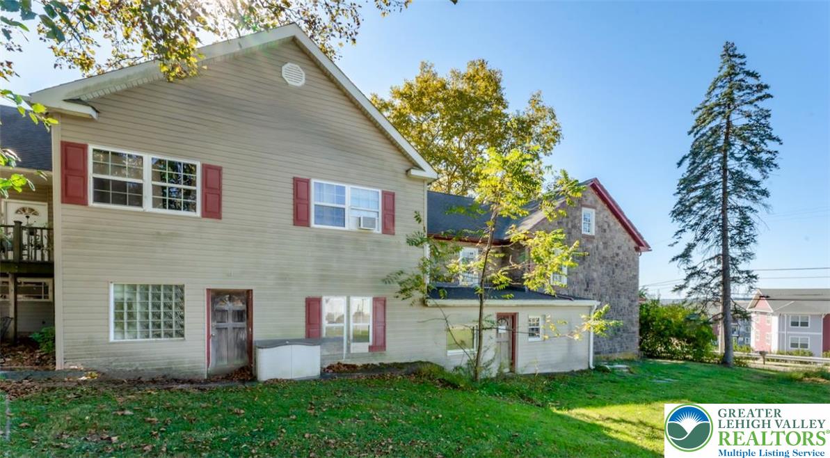 1220 Hay Road Temple, PA 19560 - Photo 4 of 27 front view of a house with a yard