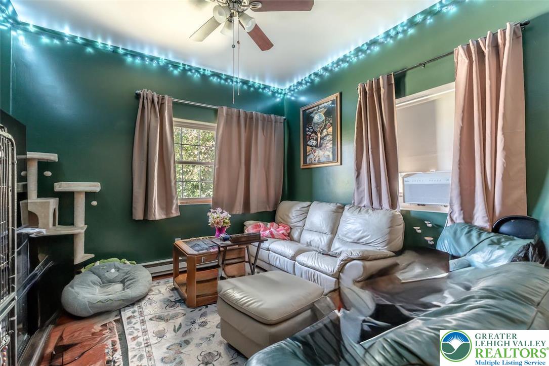 1220 Hay Road Temple, PA 19560 - Photo 10 of 27 a living room with furniture and a large window