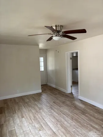 a view of an empty room with a window