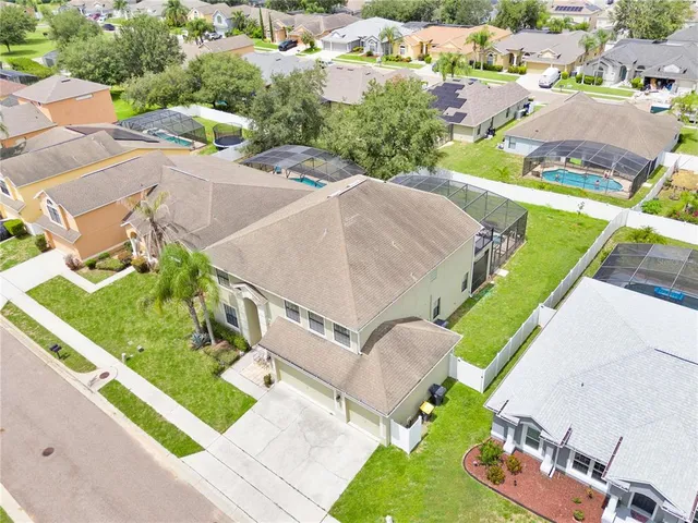 an aerial view of a house with a swimming pool