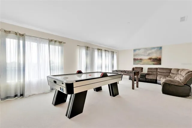 a room with a table and chairs