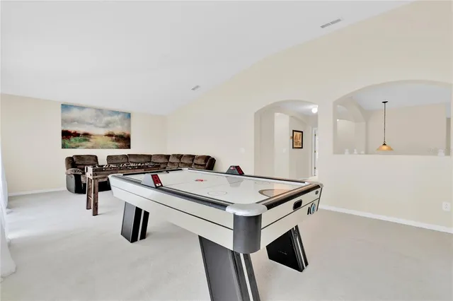 a living room with furniture a couch and a piano table