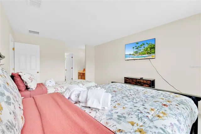 a bathroom with a double vanity sink a toilet and a mirror