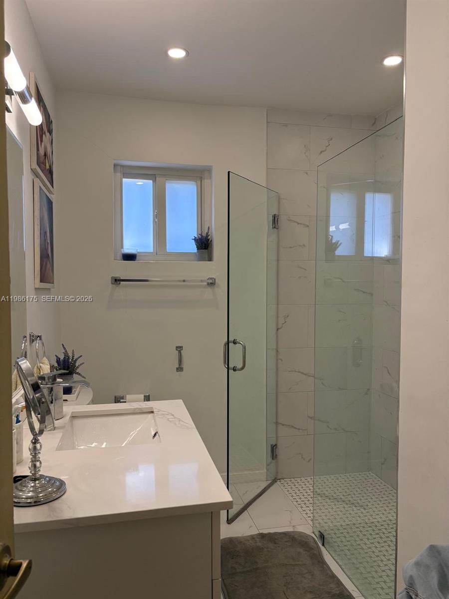 1758 Southwest 18th Street Miami, FL 33145 - Photo 5 of 15 a bathroom with a sink a shower and a mirror