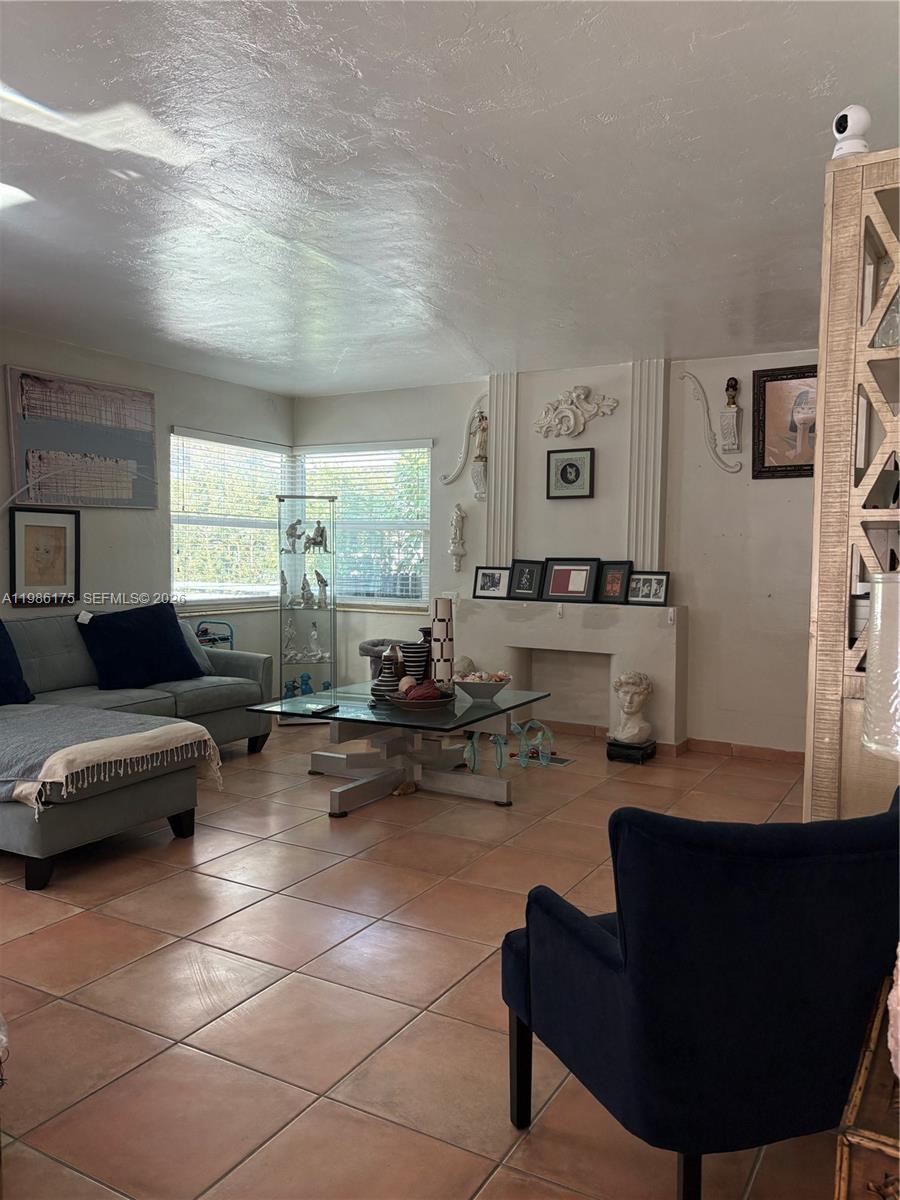 1758 Southwest 18th Street Miami, FL 33145 - Photo 6 of 15 a living room with furniture and a large window