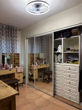 a kitchen with a refrigerator and a stove