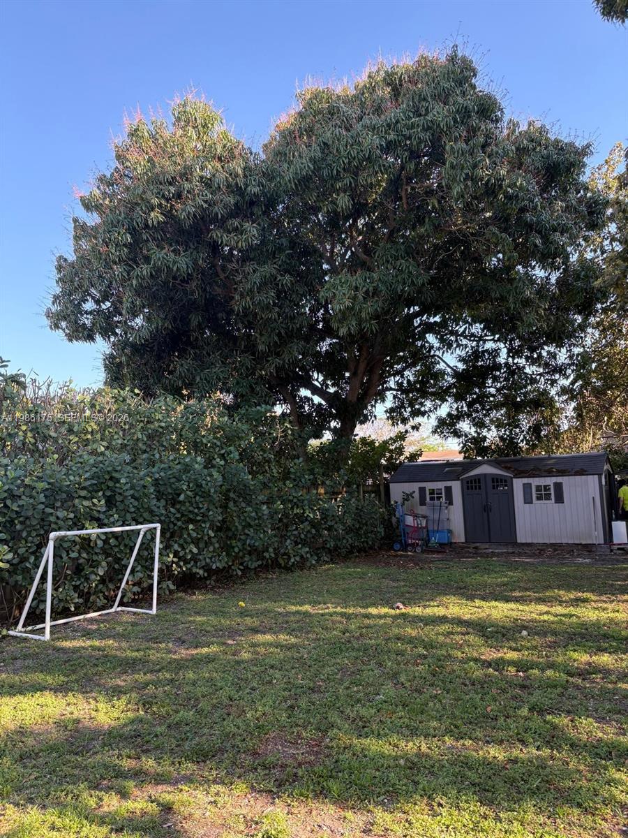 1758 Southwest 18th Street Miami, FL 33145 - Photo 9 of 15 a view of a swimming pool with a yard