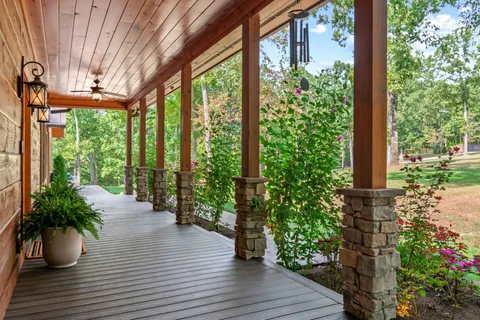a view of a patio with a chairs and table in the patio