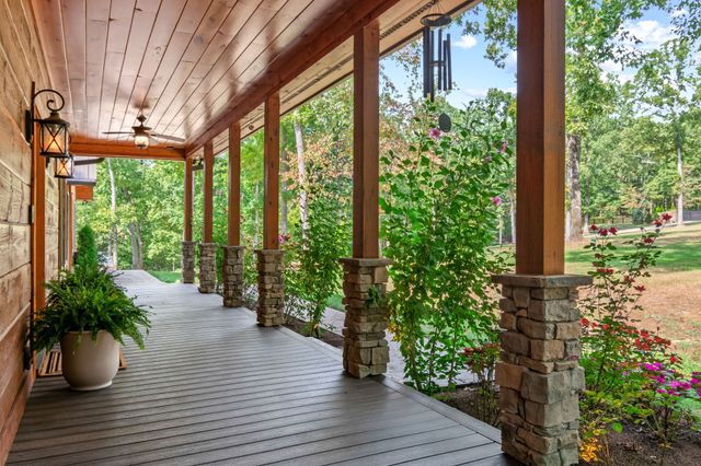 a view of a patio with a chairs and table in the patio
