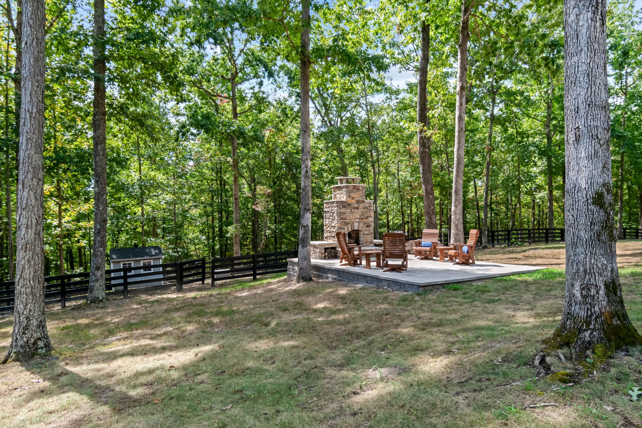 6011 Garrison Springs Road Franklin, TN 37064 - Photo 76 of 99 a view of back yard with table and chairs and wooden fence