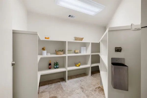 a view of a hallway view with wooden floor and furniture