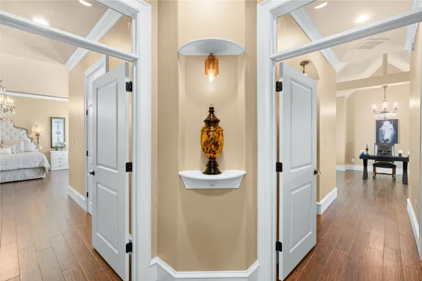 a spacious bedroom with a bed and a window