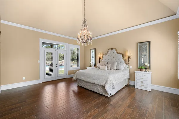 a view of walk in closet and bedroom