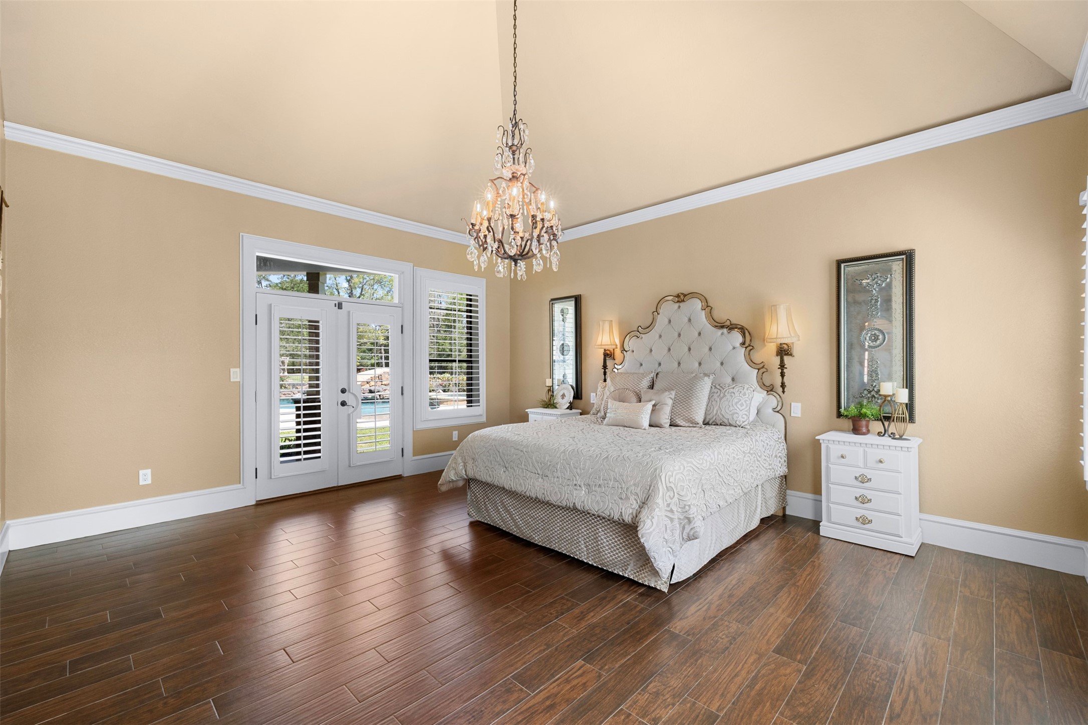 29500 Skymac Ranch Road Hempstead, TX 77445 - Photo 18 of 50 The room is illuminated by a stunning crystal chandelier, while designer sconces provide soft, layered lighting—creating a luminous, upscale atmosphere reminiscent of a European estate.