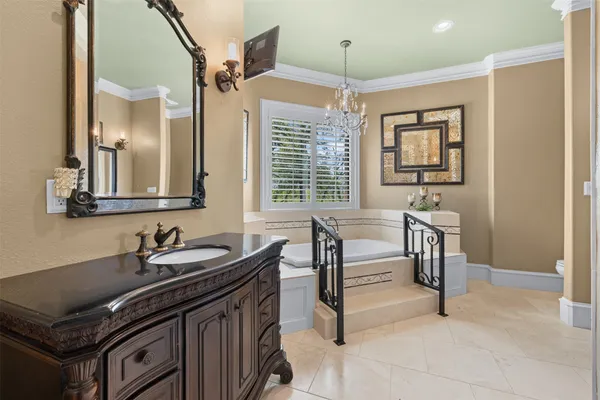 a bathroom with a sink a mirror and a shower