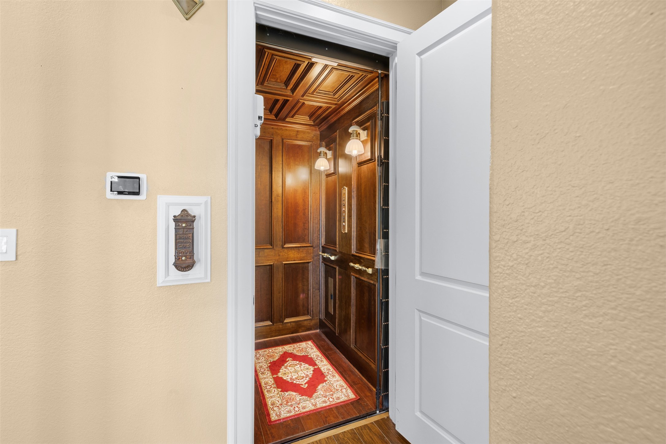 29500 Skymac Ranch Road Hempstead, TX 77445 - Photo 29 of 50 More than just convenient, the private elevator is beautifully finished with wood detailing and European charm, highlighted by unique lighting from a vintage rail car.