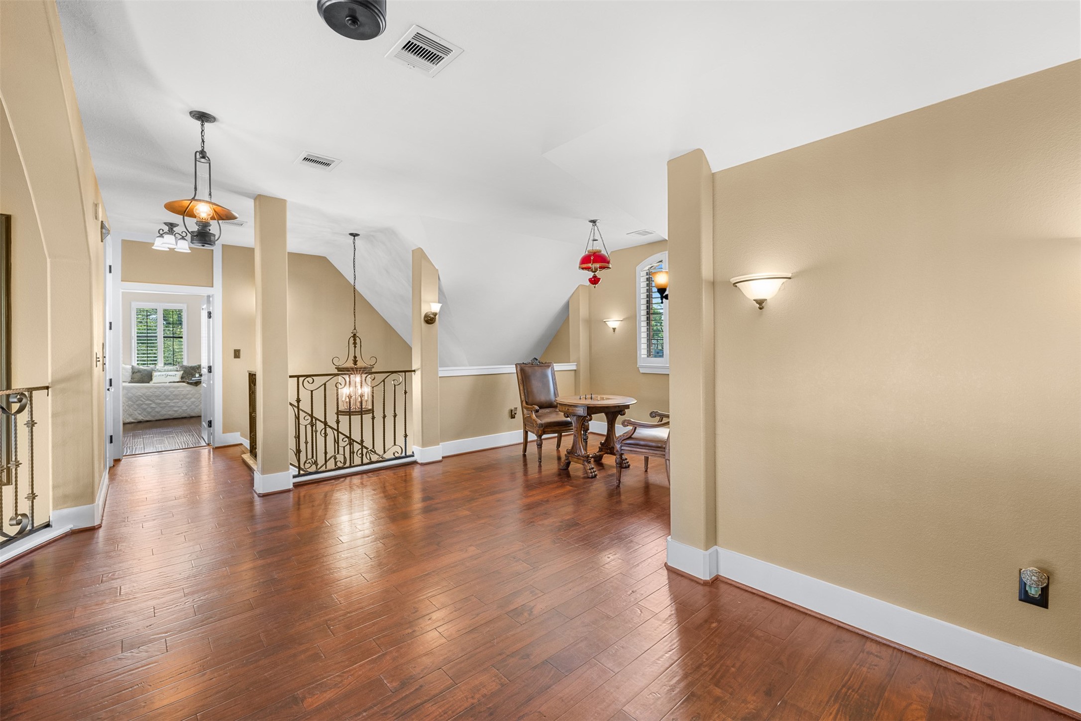 29500 Skymac Ranch Road Hempstead, TX 77445 - Photo 30 of 50 An open loft overlooks the main living area below, creating a striking architectural feature and offering a versatile space ideal for a game area, lounge, or additional living space.